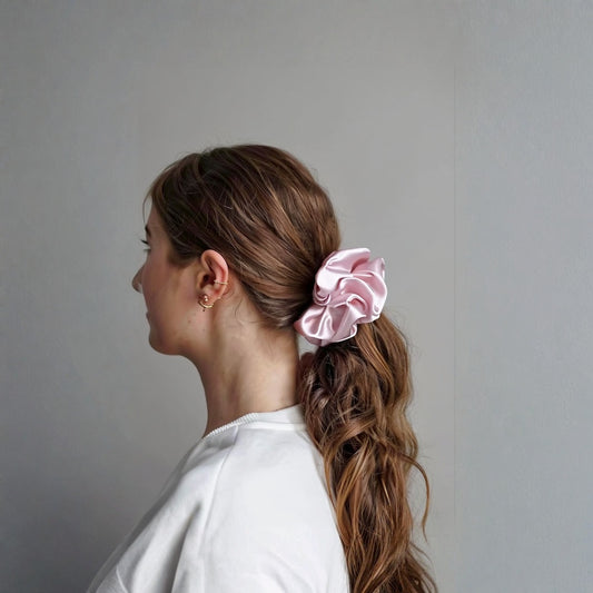 Woman with a pink scrunchie in her hair