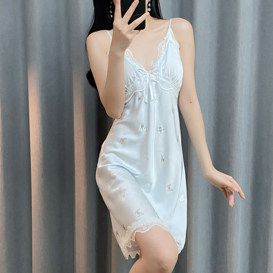 Woman wearing a light blue satin nightgown
