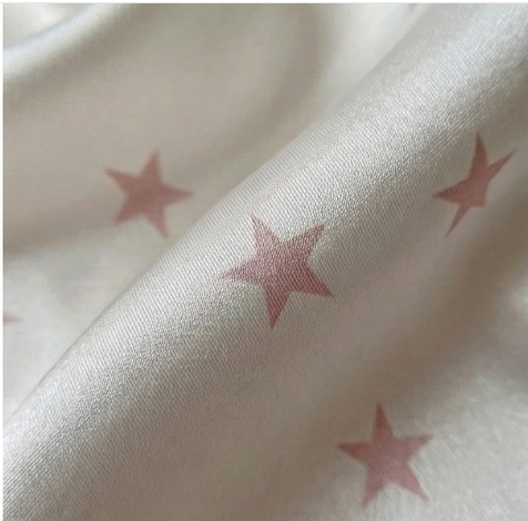 White fabric with pink star patterns
